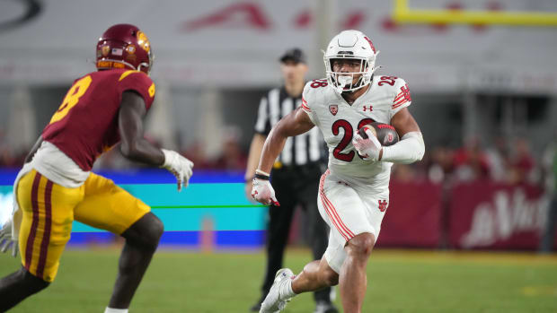 Oct 21, 2023; Los Angeles, California, USA; Utah Utes safety Sione Vaki (28) carries the ball against the Southern California Trojans in the first half at United Airlines Field at Los Angeles Memorial Coliseum. Mandatory Credit: Kirby Lee-USA TODAY Sports